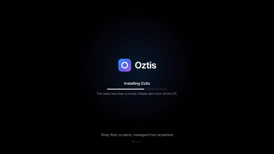 Station screen during install: the Oztis logo, “Installing Oztis” and a progress bar, with the note “This takes less than a minute.”